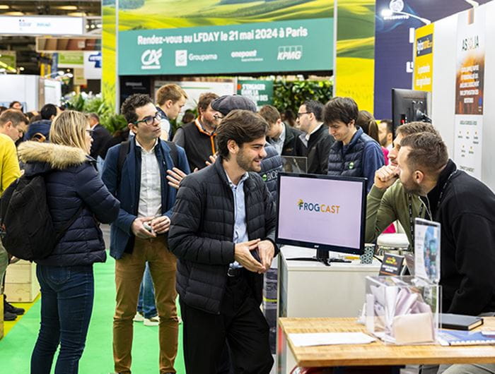 Professionals chatting at a booth