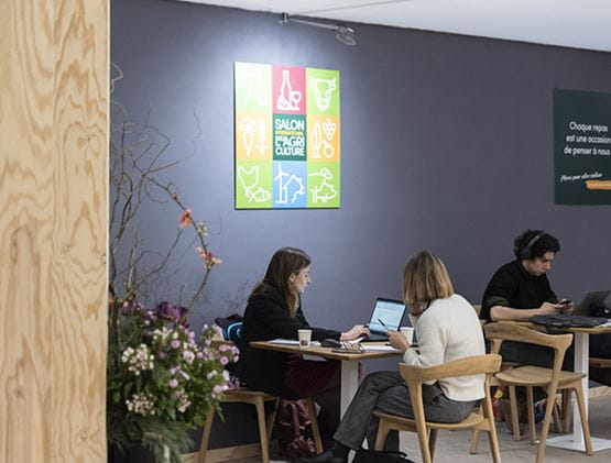 Professionals in a meeting sitting around a table